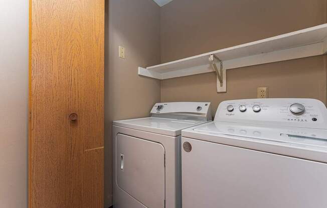 A laundry room with a washer and dryer.