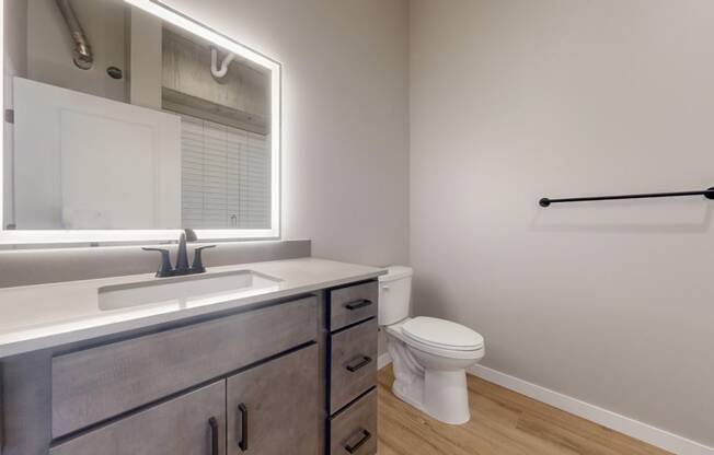 an empty bathroom with a toilet and a sink