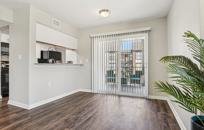 a living room with a sliding glass door and a window