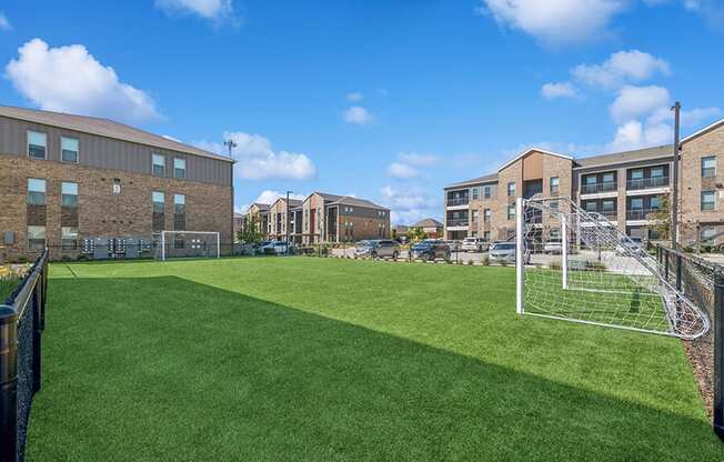 Community Soccer Field with Nets at Alta 3Eighty Apartments located in Aubrey, TX.