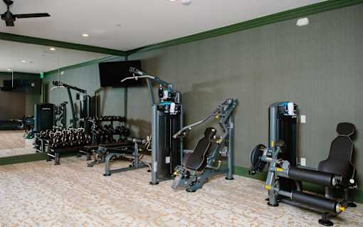 a room filled with lots of different types of exercise equipment at Fairfax, Grandview, 43212