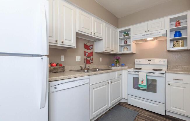 a white refrigerator freezer sitting inside of a kitchen