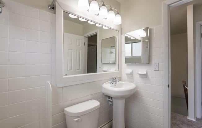 This is a photo of the bathroom of the 1004 square foot, 2 bedroom/1 bath Townhome with stackable washer/dryer floor plan at Colonial Ridge Apartments in the Pleasant Ridge neighborhood of Cincinnati, OH.
