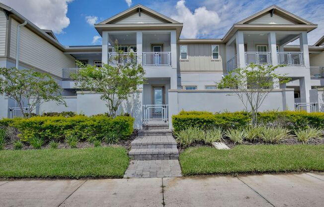 Stunning 3/2.5 Modern Townhome with a Private Courtyard and a Spacious 2 Car Garage in the Desirable Laureate Park Community in Lake Nona - Orlando!