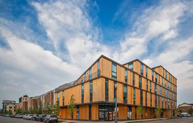 a large brick building on the corner of a city street