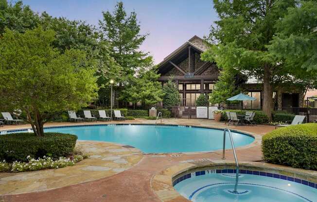 a swimming pool with a hotel in the background