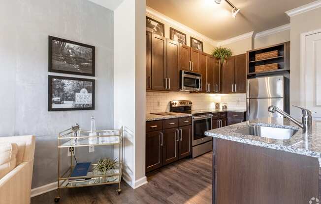 a kitchen with stainless steel appliances and wooden cabinets