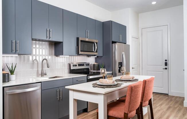 Discover ample space for meal prep and entertaining with the expansive chef’s kitchen island at Modera Garden Oaks.