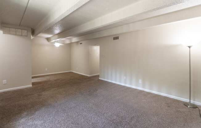 This is a photo of the living room in the 965 square foot 2 bedroom, 2 bath  apartment at Harvard Square Apartments, in Dallas, TX.