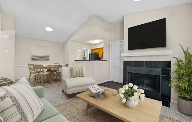 a living room with a fireplace and a television