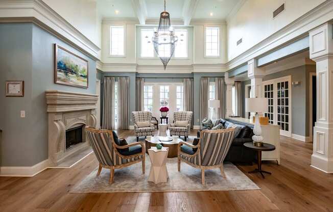 A living room with a fireplace and a painting on the wall.