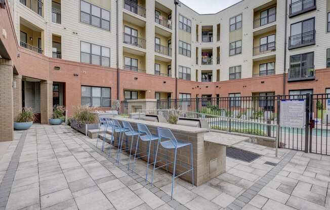 Outdoor Grill With Intimate Seating Area at The Lincoln Apartments, Raleigh