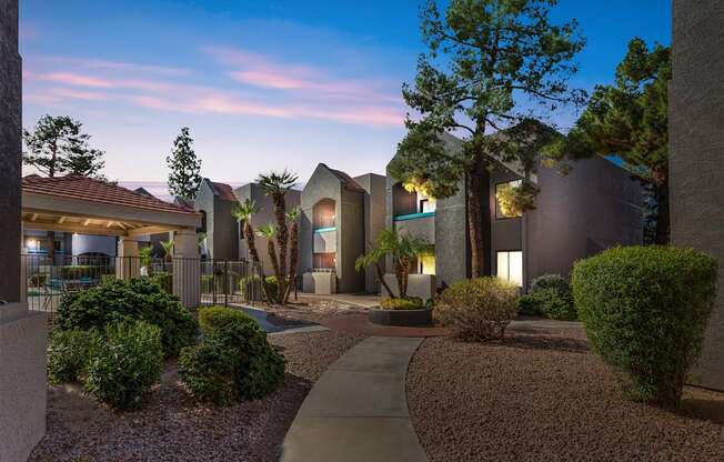 A modern residential area with a well-maintained garden and pathway.