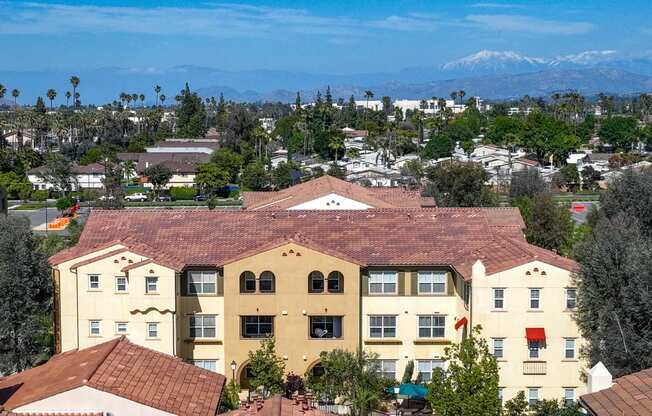 a view of the city and mountains from the top of a building