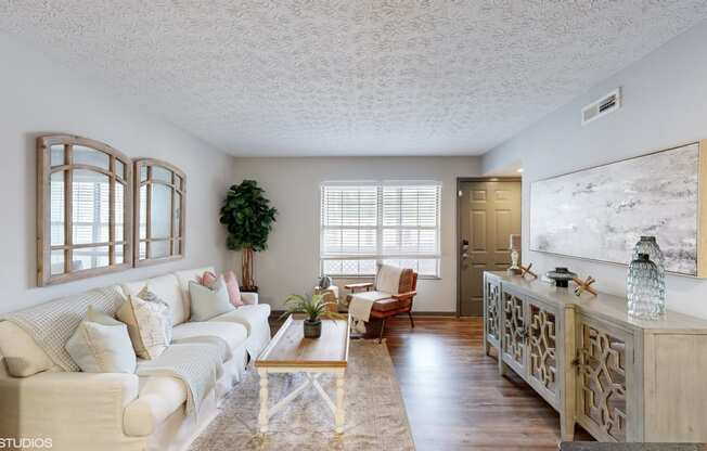 a living room with a couch and a table