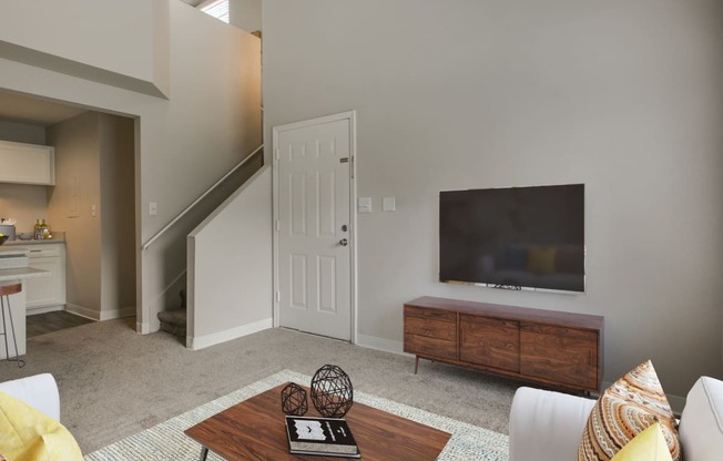 a living room with a couch and a tv