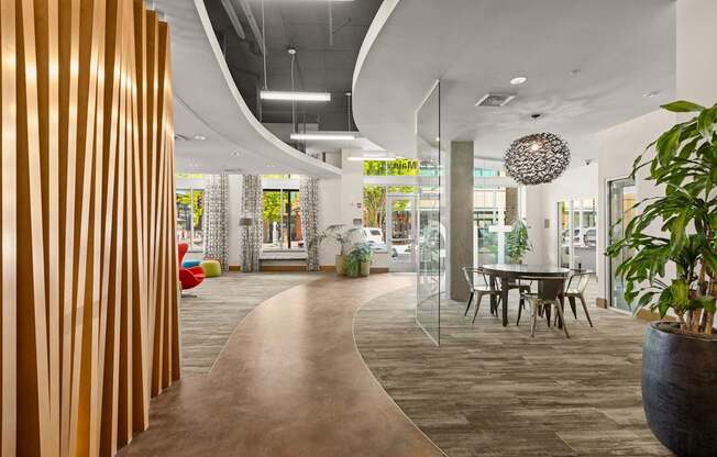 a dining area with a table and chairs in a lobby