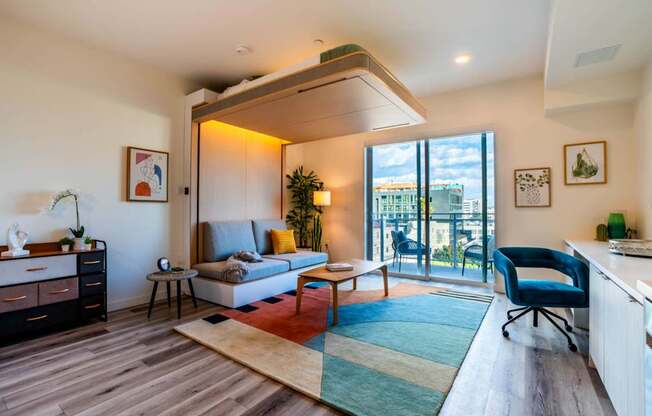 a living room with a couch and a balcony