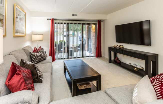 Spacious living room with patio at Ivy Hall Apartments