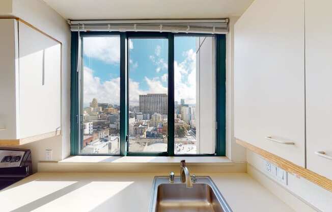 a kitchen with a large window and a sink