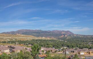 a view of a city with a mountain in the background