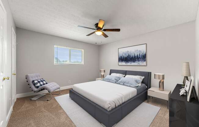 a bedroom with a bed and a ceiling fan