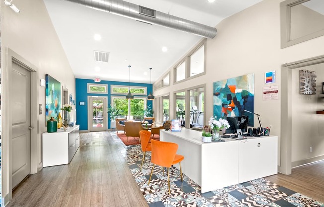 Retreat at Indian Lake Hendersonville TN leasing office with a white reception desk and orange chairs.