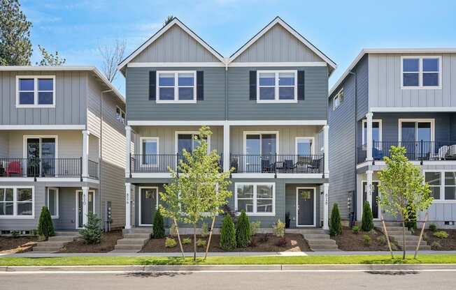 a row of houses on the side of a street