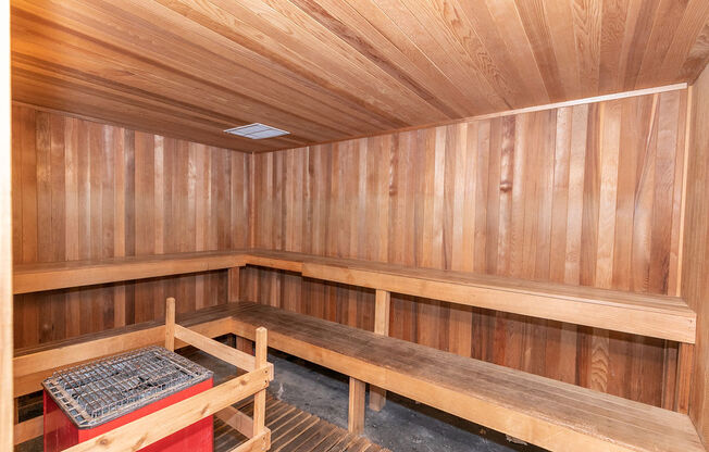 a wooden sauna with benches and a table at Deerfield Village, Alpharetta, GA