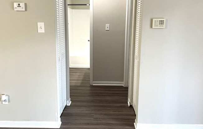 a view of the hallway from the living room into the bedroom and closet