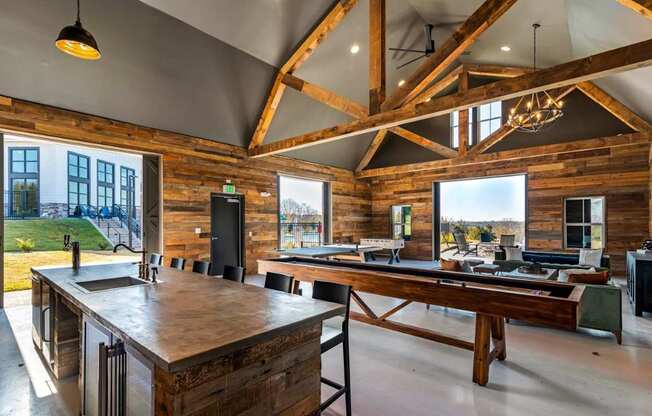 A kitchen with wooden cabinets and a large island.