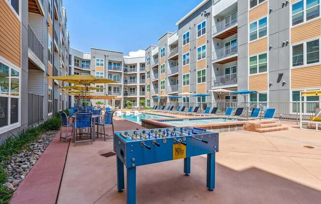 play a game of foosball at the reserve at south coast apartments