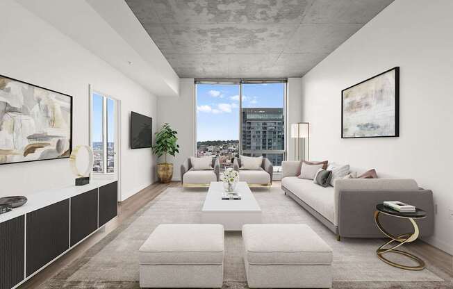 A modern living room with a large window and a view of the city.