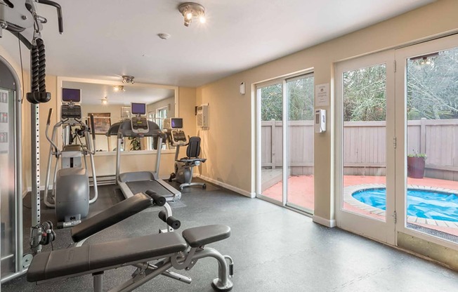 a gym with weights and a pool in the corner at Quartz Creek, Washington