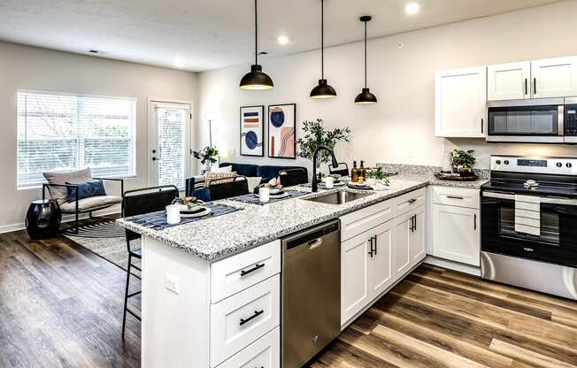 Studio, one and two bedroom apartment homes featuring stainless steel appliances, luxury vinyl floor, granite countertops, large closets and full-size washer and dryer at The Parker in Papillion, NE