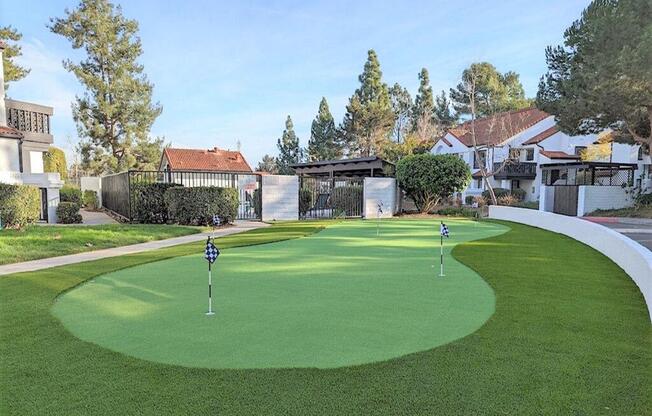 a putting green with houses in the background  at The Resort at Encinitas Luxury Apartment Homes, Encinitas, CA