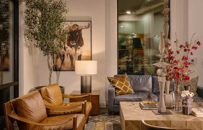 a living room with leather furniture and a large mirrorat Weylyn Luxury Apartments, Arizona, 85339