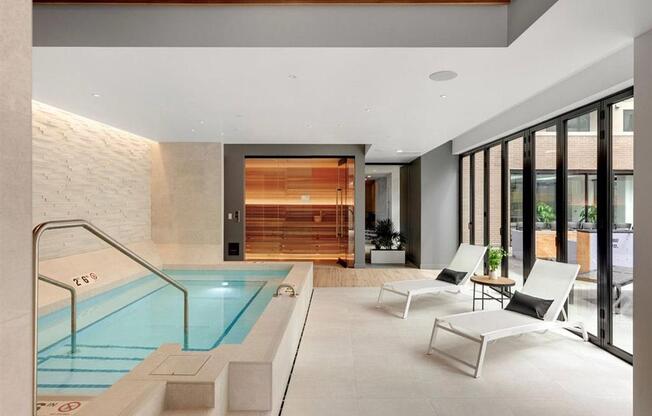 hot tub with lounge seating and sauna