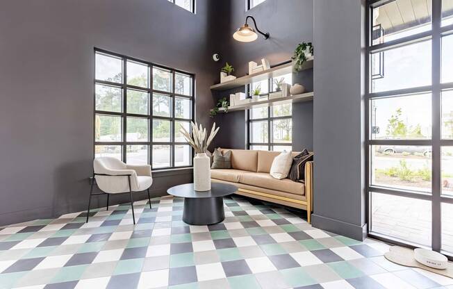 Cozy entryway with cozy seating area and pet water bowl at Novel Cary