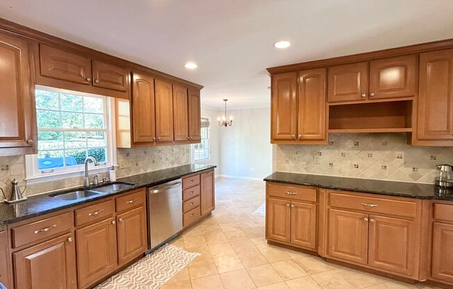 Fabulous Dunwoody Property Situated in a Perfect Location!  Hardwoods, Stainless, Granite!