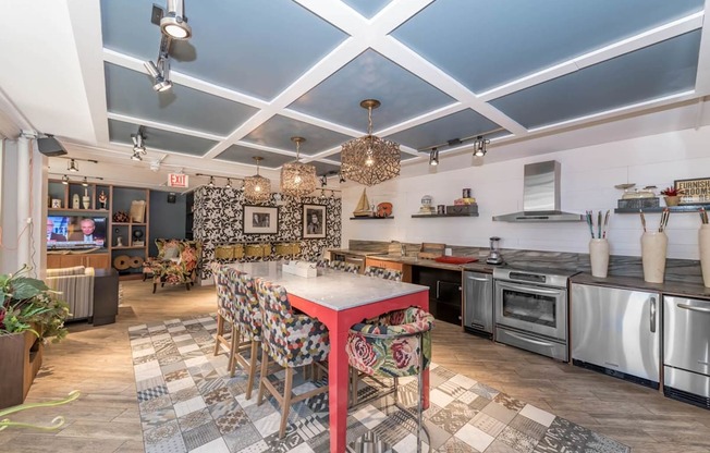 a kitchen and dining room with a long table and counter tops