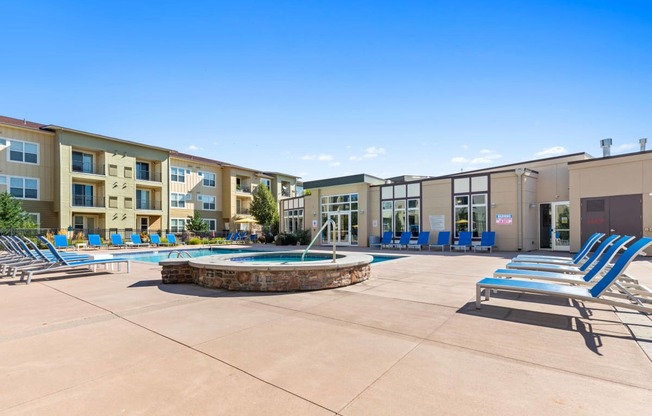 our apartments offer a pool and hot tub with lounge chairs