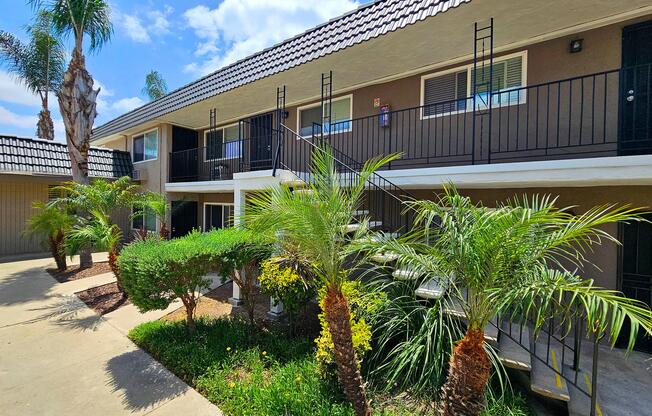 a house with bushes in the background