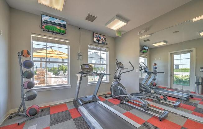 fitness room with exercise equipment