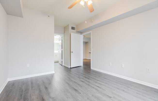 a bedroom with hardwood floors and white walls at Heritage Bay, Florida, 34957