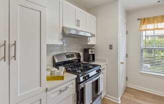 Orchards Apartments Marlborough ma apartment loft style apartments photo of kitchen stainless steel appliances with gas range stove and range hood with white cabinets and wood floors