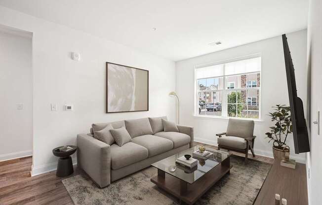 A living room with a couch, chair, and coffee table.