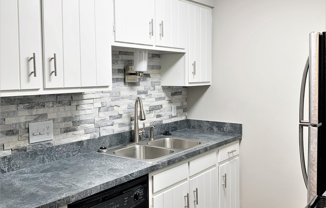 a modern kitchen with stainless steel appliances