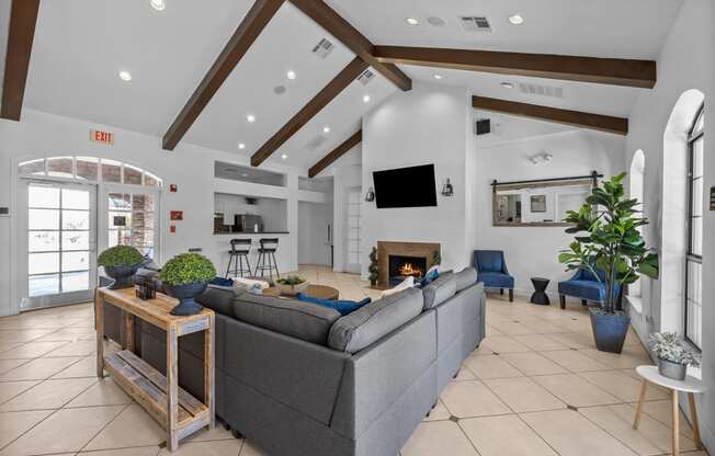 the living room of a house with a large couch and a fireplace