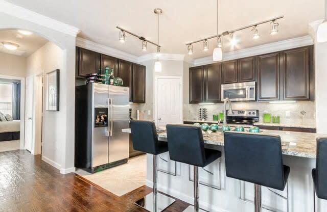 Fitted Kitchen With Island Dining at Villages of Briggs Ranch, San Antonio, 78245